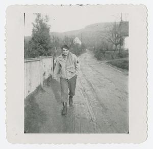 Primary view of object titled '[Soldier Walking Down Road]'.