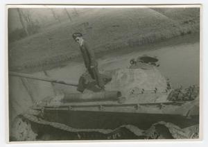 [Richard Koos Standing on a Wrecked German Tank]