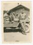 Thumbnail image of item number 1 in: '[Edwin Lahti Leaning Against a Jeep]'.