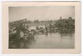 Photograph: [A Destroyed Bridge and Vehicles]