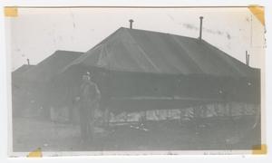 [Soldier in Front of Large Tents]
