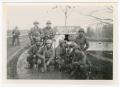 Thumbnail image of item number 1 in: '[Eight Soldiers Posing on a Bridge Over the Danube River]'.