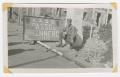 Photograph: [Soldier Beside a Sign for the Brenner Pass]
