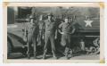 Photograph: [Three Soldiers to the Side of a Half-Track]