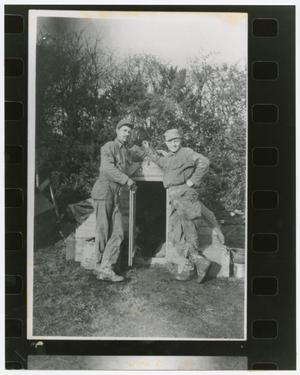 [Two Soldiers Leaning on a Small Shed]