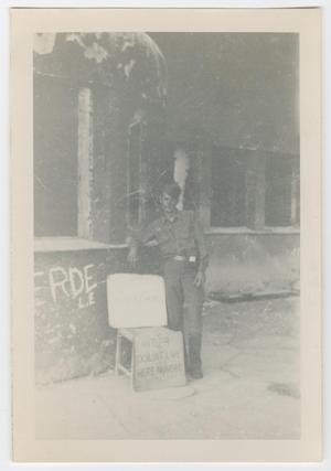 [Soldier Leaning Against a Burned Building]