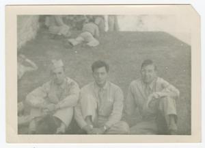 Primary view of object titled '[Three Uniformed Men Sitting in a Yard]'.