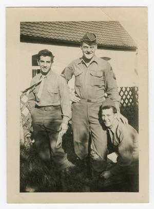 [Three Soldiers Posing in Front of a House]