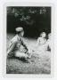 Photograph: [Soldier and Two Girls]