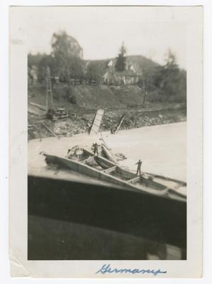 [Two Soldiers Standing on Wreckage in a River]