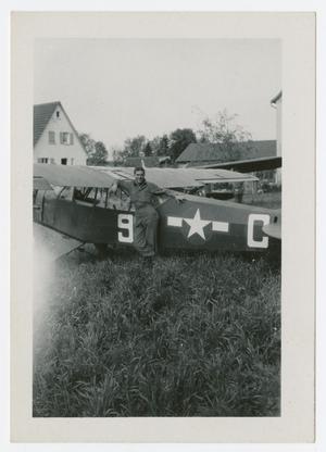Primary view of object titled '[Man with L-5 Airplane]'.