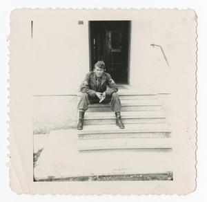 [Soldier on Steps of Building]