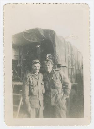 [Soldiers Standing Behind a Truck]