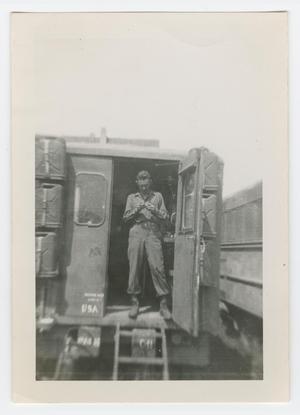 [Soldier Standing in Doorway of a Maintenance Van]