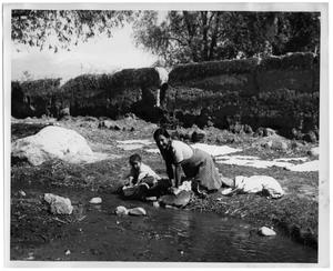 [Photograph of Woman and Child Washing Clothes]