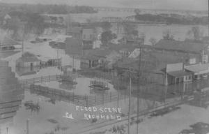 Primary view of object titled '[The flood scene in Richmond. Fenced area in foreground.]'.