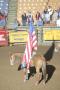 Photograph: [Event at the Cowtown Coliseum, woman flag bearer]