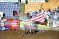 Photograph: [Event at the Cowtown Coliseum, woman flag bearer]