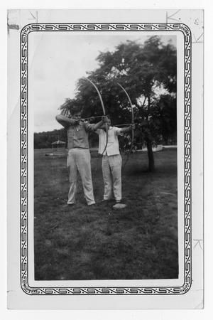 [Two unknown young men practicing archery]
