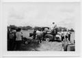 Photograph: [Group of people loading a pickup truck]