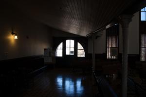 [Photograph of a Darkened Courtroom]
