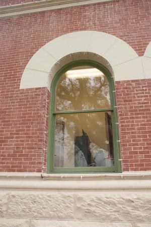 [Photograph of Window with Green Trim]