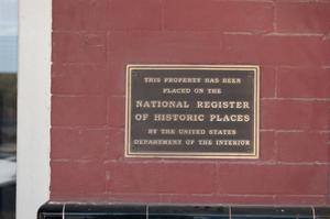 [Plaque on Red Brick Building]