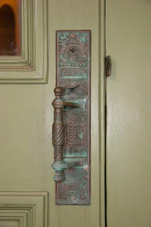 [Photograph of Carved Door Handle]