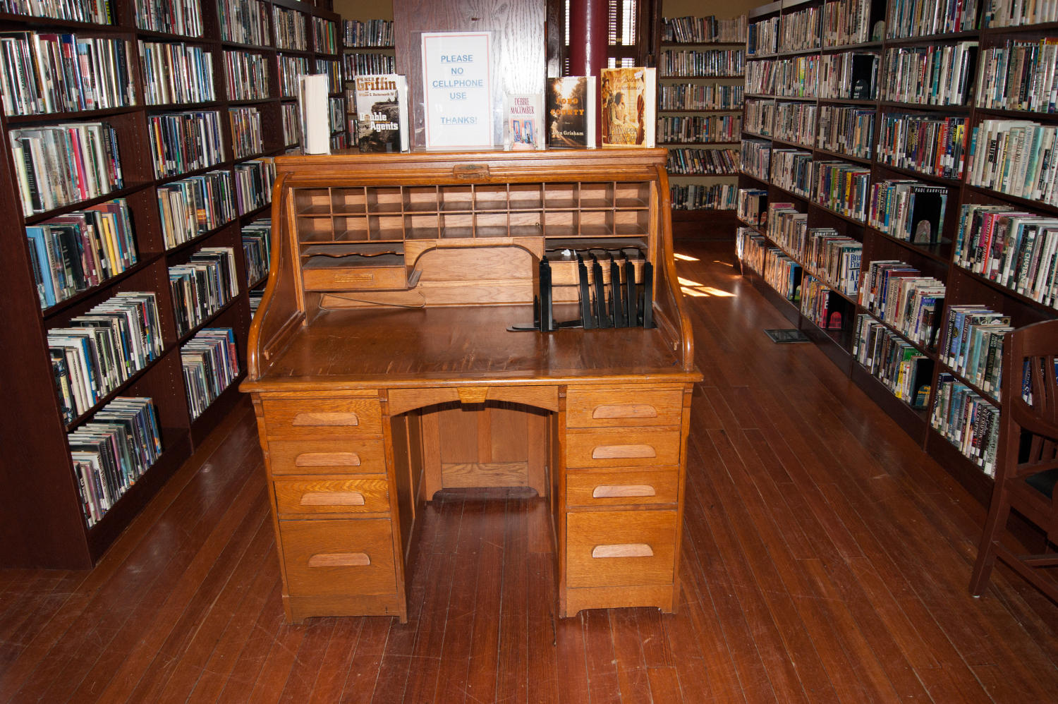 [Photograph of a Desk in a Library]
                                                
                                                    [Sequence #]: 1 of 1
                                                
