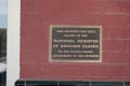 Photograph: [Photograph of Plaque on Building]