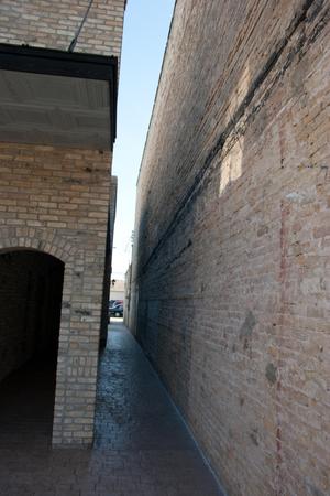 [Photograph of a Narrow Brick Alley]