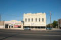 Photograph: [Exterior of Two Auto Stores]