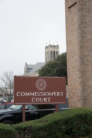 [Photograph of Commissioners' Court Sign]