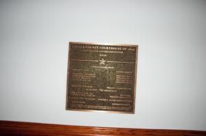 [Photograph of a Courthouse Restoration Plaque]
