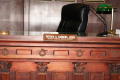 Photograph: [Close-Up of Sign on Judge's Bench]