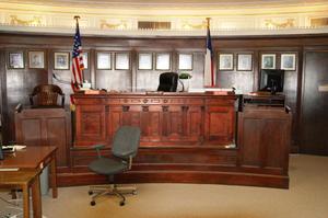 [Photograph of a Judge's Bench and Witness Stand]