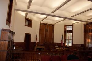 [Interior of a Courtroom]