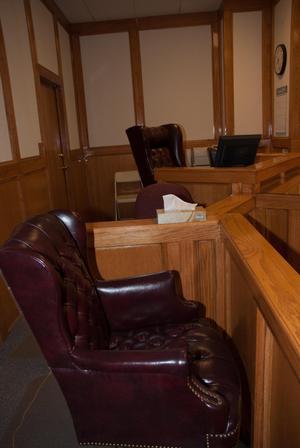 Primary view of object titled '[Large Leather Chairs Behind Judge's Bench]'.