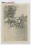 Photograph: [Soldier Standing by Cart]