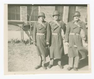 Primary view of object titled '[Three Soldiers Wearing Coats and Helmets]'.