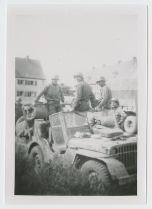 [Soldiers on Jeep]