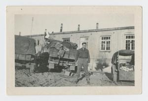 Primary view of object titled '[Charles Thomason by Trucks]'.