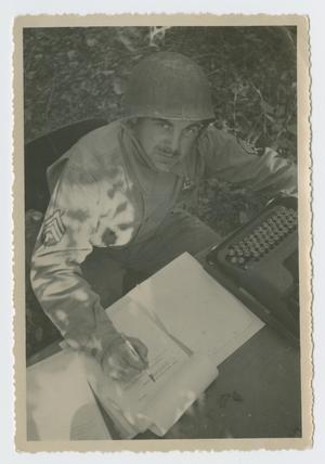 Primary view of object titled '[Sergeant at Desk]'.