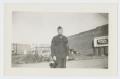 Photograph: [Soldier In Front of Sign]
