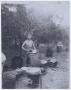 Thumbnail image of item number 1 in: '[Eugene Ward Doing Dishes]'.