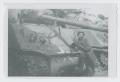 Photograph: [Soldier Leaning Against Tank]