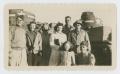 Photograph: [Group in Front of Tanks]