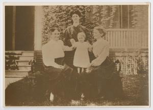 [Photograph of Women and Girl on a Bench]