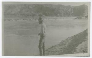 [Photograph of a Man by a River]