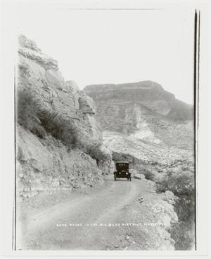 [Photograph of a Car on a Mountain Road]